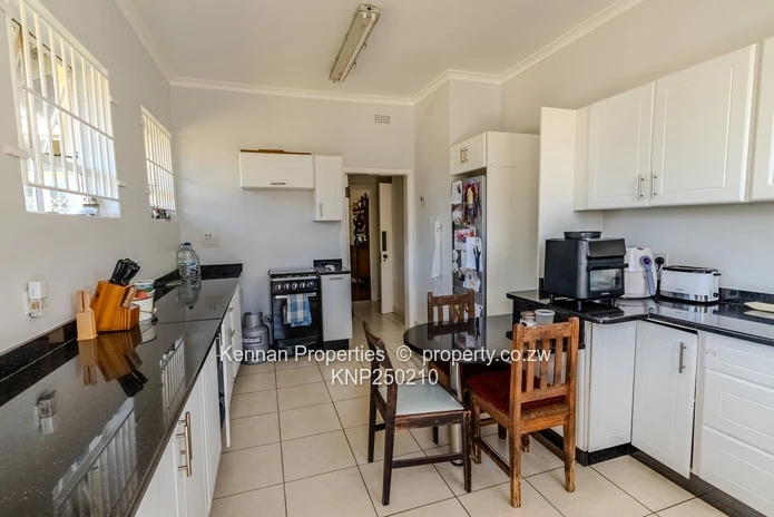 Attractive five bedroom home on two and a half acres. Good water and Msasa trees. (Sole Mandate)