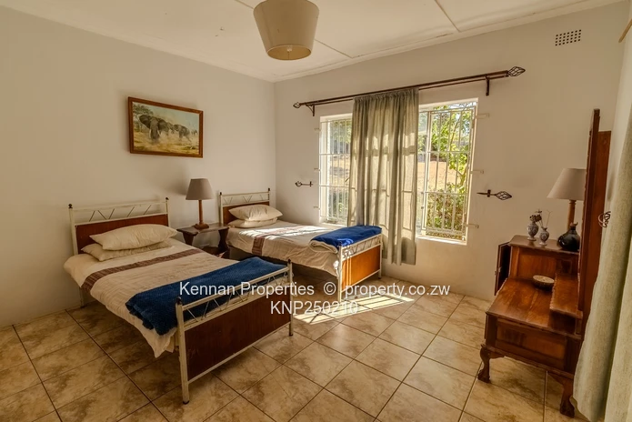Attractive five bedroom home on two and a half acres. Good water and Msasa trees. (Sole Mandate)