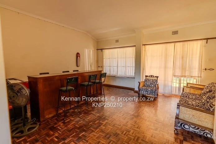 Attractive five bedroom home on two and a half acres. Good water and Msasa trees. (Sole Mandate)